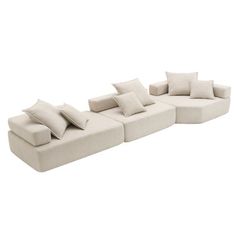 a white couch with pillows on it