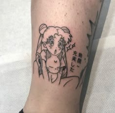 a tattoo on the leg of a person with an animal in it's head