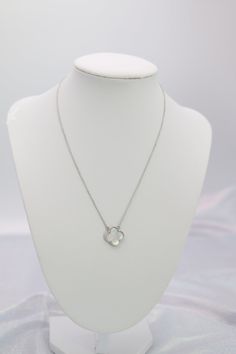 A silver clover necklace features a luminous silver chain adorned with a delicate clover-shaped pendant, exuding simplicity and elegance. The cool tone of the silver complements the symbolic clover pendant, making it a versatile piece that adds a touch of luck and refinement to any outfit. Length: 16” Clover Measurements : 15.0 mm Closure: Lobster Claw Material: Brass with Silver Plating and Rhodium Coating Lead Free and Hypoallergenic Silver Clover Necklace, Silver Flower Shaped Necklace With Delicate Chain, Silver Flower-shaped Necklace With Delicate Chain, Pendant Making, Four Leaf Clover Necklace, Clover Pendant, Clover Flower, Clover Necklace, Holiday Jewelry