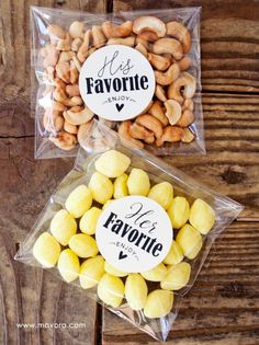 two bags filled with candies sitting on top of a wooden table next to each other