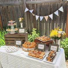 a table topped with lots of pastries and desserts