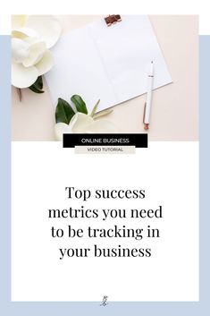 a notepad and pen sitting on top of a desk next to a flower with the words top success metas you need to be tracking in your business