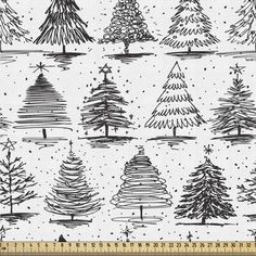 hand drawn christmas trees in black and white with snowflakes on the background stock photo