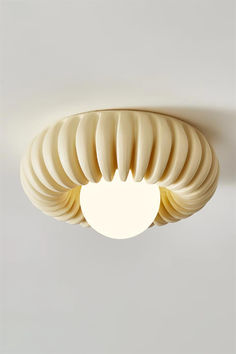 a ceiling light that is shaped like a shell