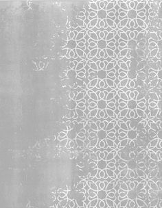 a gray and white background with an intricate design on the bottom half of the image