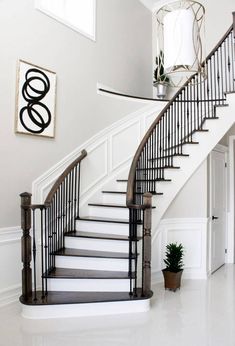 a staircase in a house with white walls