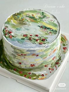 a cake with water lilies painted on it