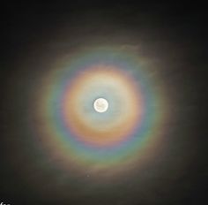 the moon is seen through an object in the sky