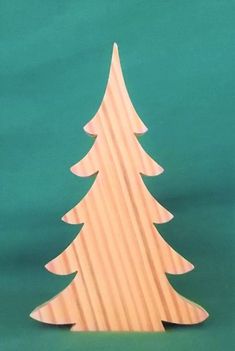 a wooden christmas tree on a green background