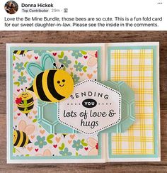 a close up of a card with a bee on it and the words sending you lots of love & hugs