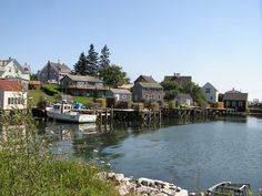 a body of water surrounded by small houses