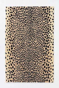 an animal print pattern is shown on the wall in front of a white background with black spots