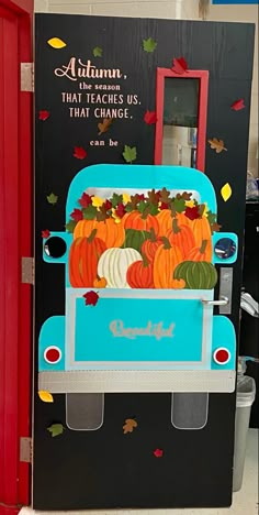 a vending machine that has pumpkins on the front and sides with words autumn