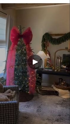 a living room with a christmas tree in the corner and presents on the table next to it