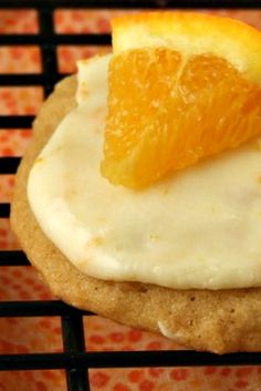 an orange slice is placed on top of a cookie