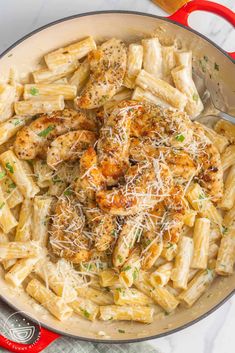 pasta with chicken and parmesan cheese in a skillet