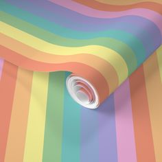 a multicolored striped wallpaper with a white hole in the middle