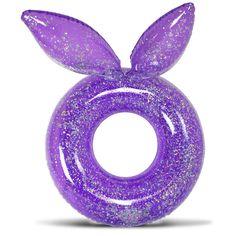 a purple plastic toy with glitter on it's face and ears, sitting in front of a white background