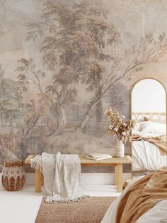 a bed room with a large painting on the wall