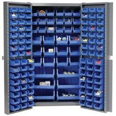 the storage cabinet is full of blue bins and plastic trays for various items