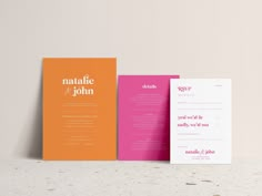 three different colored wedding cards on top of each other, one with the word's name