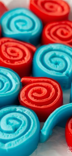 red, white and blue swirls are arranged in a pattern on top of each other