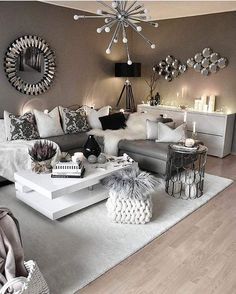 a living room filled with lots of furniture and decor