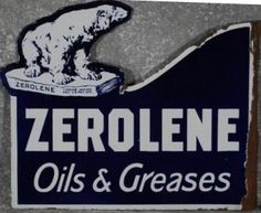 a blue and white sign that says zerolene oils and greases on it