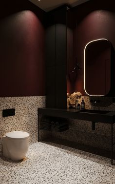 a bathroom with a sink, mirror and toilet in it's center wall area