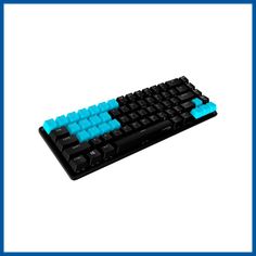 a black keyboard with blue keys on a white background and a rainbow - hued backdrop