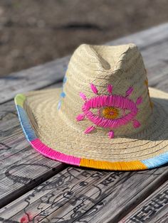 Check out this Fedora Embroidered Hat, your new go-to Sun Hat for beating the heat in style. This bamboo straw hat isn't just any ordinary Summer Hat; it's a piece of tradition with a trendy twist - the perfect blend of a Sombrero Mexicano and a Boho Hat. With intricate evil eye embroidery hat detailing, it's not only protective but also a fashion statement. This Straw Hat boasts a generous wide brim hat design, promising to keep you cool and shaded whether you're lounging by the beach or sipping a drink at your favorite outdoor spot. Taking cues from the iconic panama straw hat, it's designed for both comfort and chicness, letting you channel those summer vibes effortlessly. And because it's a raffia hat, you're rocking an eco-friendly choice that feels as good as it looks. Looking for a Multicolor Straw Hat For Summer Rodeo, Western Style Multicolor Sun Hat For Beach, Western Multicolor Sun Hat For Beach, Fun Adjustable Straw Hat With Curved Brim, Multicolor Western Sun Hat For Summer, Western Multicolor Straw Hat For Summer, Western Style Multicolor Straw Hat For Summer, Multicolor Western Straw Hat For Summer, Multicolor Curved Brim Sun Hat For Rodeo