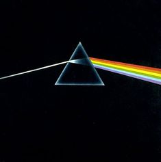 the dark side of the moon with a rainbow in it