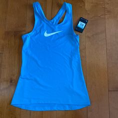 Nwt Nike Pro Dri Fit Tank Top Size Medium Blue White Swoosh Functional Blue Racerback Tops, Blue Go-dry Racerback Top, Blue Racerback Top With Go-dry Technology, Blue Moisture-wicking Racerback Top, Functional Blue Sports Tops, Blue Racerback Sports Top, Sporty Light Blue Training Tops, Blue Racerback Top For Sports, Functional Blue Tops For Light Sports