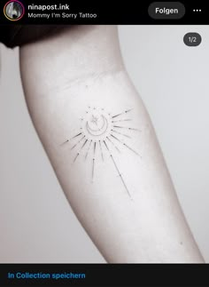 a sun tattoo on the arm with needles coming out of it's back side