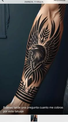 an eagle tattoo on the arm with black ink and some white writing in spanish language