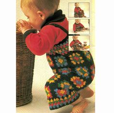 a baby is sitting on the floor next to a basket and wearing a crocheted outfit