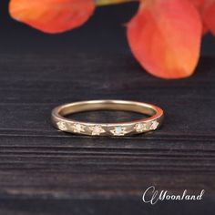 an image of a wedding ring with stars on it