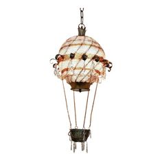 an old fashioned hot air balloon hanging from a chain