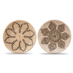 two woven baskets sitting side by side on a white surface, one with black lines and the other without