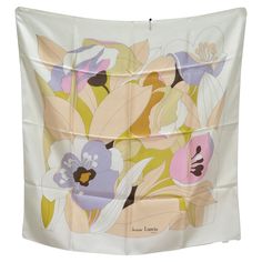 Introducing the epitome of vintage elegance: the Lanvin Floral Silk Scarf from the 1970s. Crafted with meticulous attention to detail, this scarf is a testament to Lanvin's timeless design legacy. Neutral tones and soft pastel shades intertwine to form an abstract floral motif, creating a design that exudes sophistication and charm. Made from luxurious silk, this scarf is not only a fashion accessory but also a work of art that adds a touch of luxury to your ensemble. With endless ways to style Luxury Designer Art Silk Shawl, Vintage Chanel Earrings, Print Scarf Design, Vintage Hermes Scarf, Silk Scarf Design, Designer Silk Scarves, Jeanne Lanvin, Floral Silk Scarf, Versace Dress