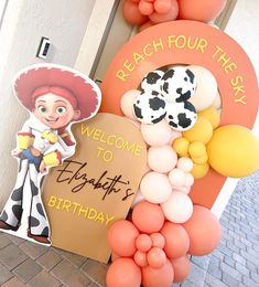 a welcome sign and balloon decorations for a birthday