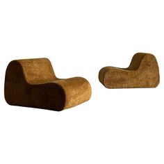 two brown chairs sitting next to each other