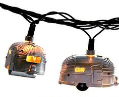 two camper trailer lights hanging from a wire