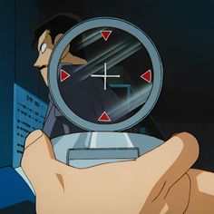 a person holding a clock in their hand