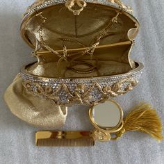 The Style Of A Classic Faberge’ Egg With Crystals Inlaid & Gold Ribbon /Bow Grid Details. Gold Chain Shoulder Strap. Gold Interior With 2 Compartments. Includes Gold Comb, Mini Mirror & Coin Purse. Very Good Condition Glamorous Evening Shoulder Bag With Gold-tone Hardware, Glamorous Evening Bag With Gold-tone Hardware, High-end Luxury Evening Bag With Gold-tone Hardware, Luxury Gold Evening Bag With Gold-tone Hardware, Glamorous Gold-tone Evening Bag, Mini Mirror, Gold Evening Bag, Judith Leiber Handbags, Judith Leiber Bags