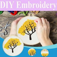 someone is working on an embroidery project with yellow trees