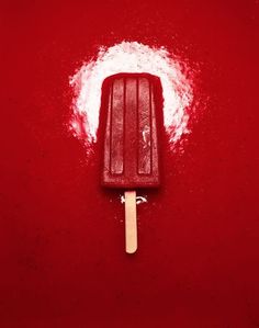 an ice cream popsicle on a red background