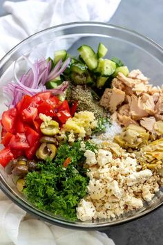 a glass bowl filled with different types of food