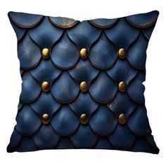 a blue pillow with gold buttons on it