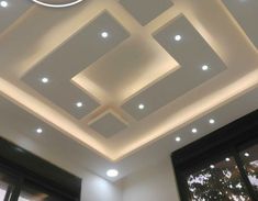 the ceiling in this room is decorated with white lights and recessed lighting above it